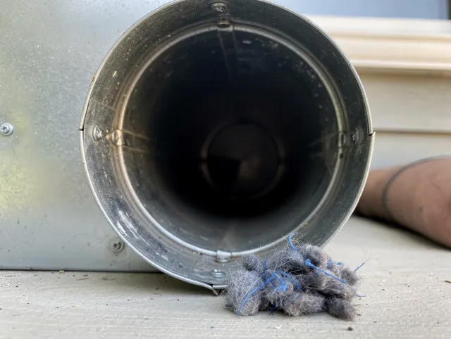 Cudahy Dryer Vent Cleaning technician using specialized equipment to clear severe dryer vent blockage in Cudahy
